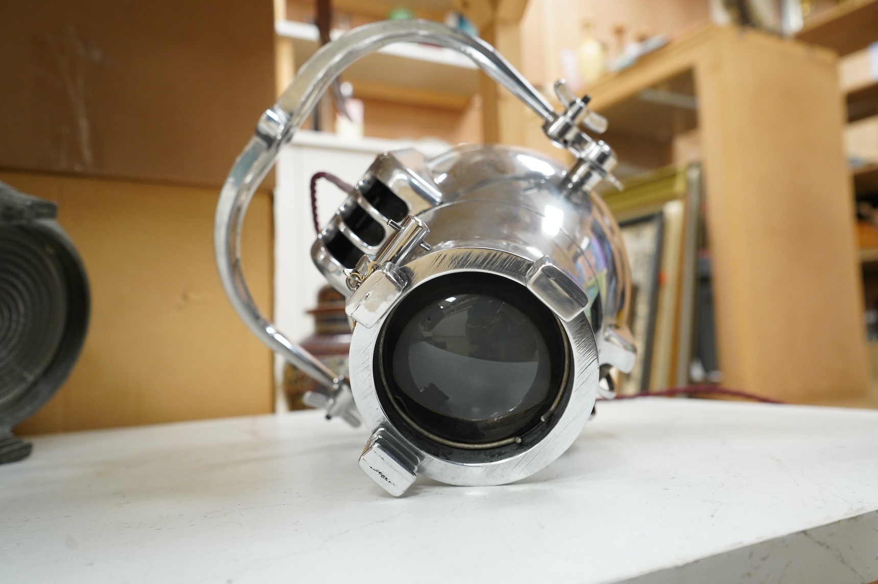 A vintage Strand electric chrome theatre lamp